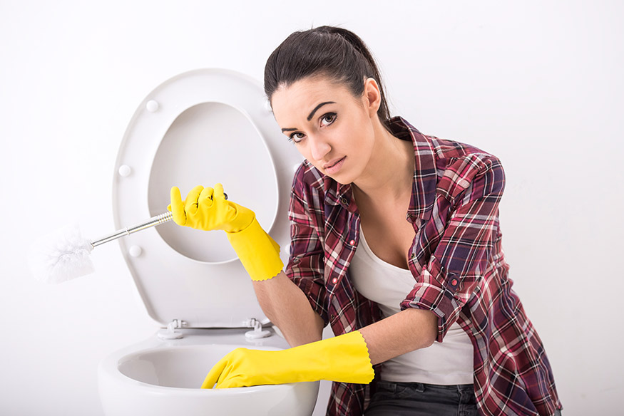 Woman Cleaning Toilet 